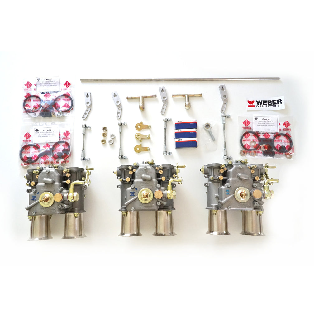 3 Weber 45 DCOE Carburettor laid out with linkage kit