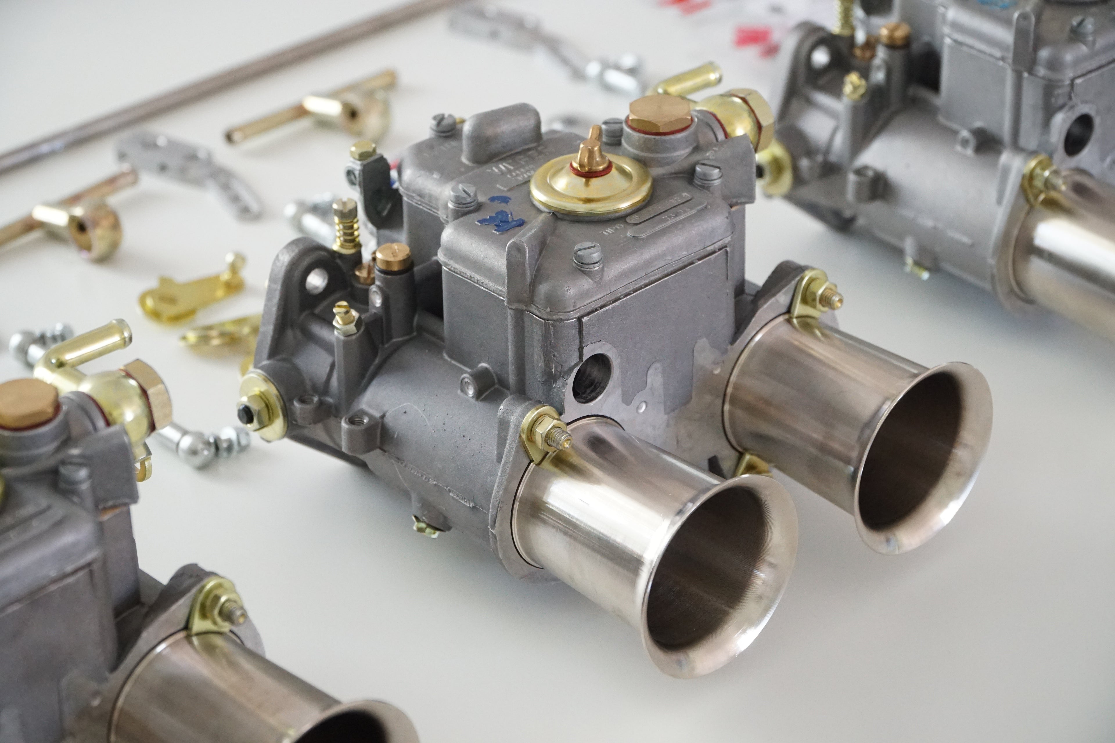 close-up of Weber 45 DCOE on white table